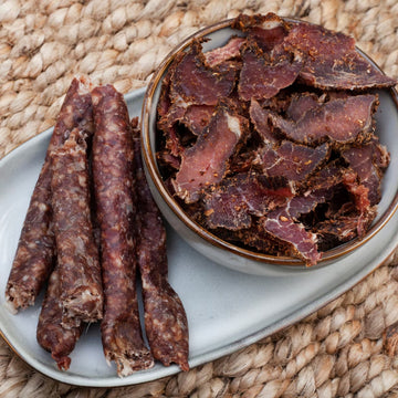 Padstal Deli Biltong on a table in a bowl. 

